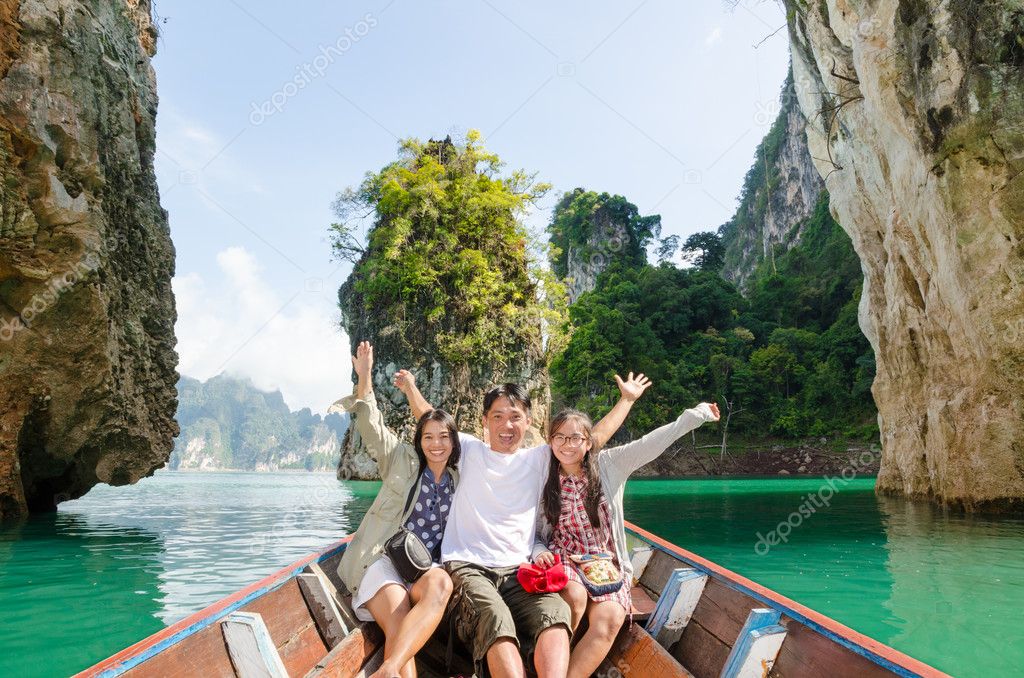 Happy family travel boat ( Guilin of Thailand ) Stock Photo by ©yongkiet 41564377